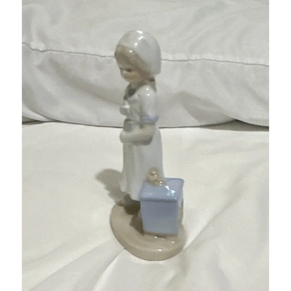 The K Collection, Inc. vintage Glazed Porcelain Nurse Figurine White/Blue